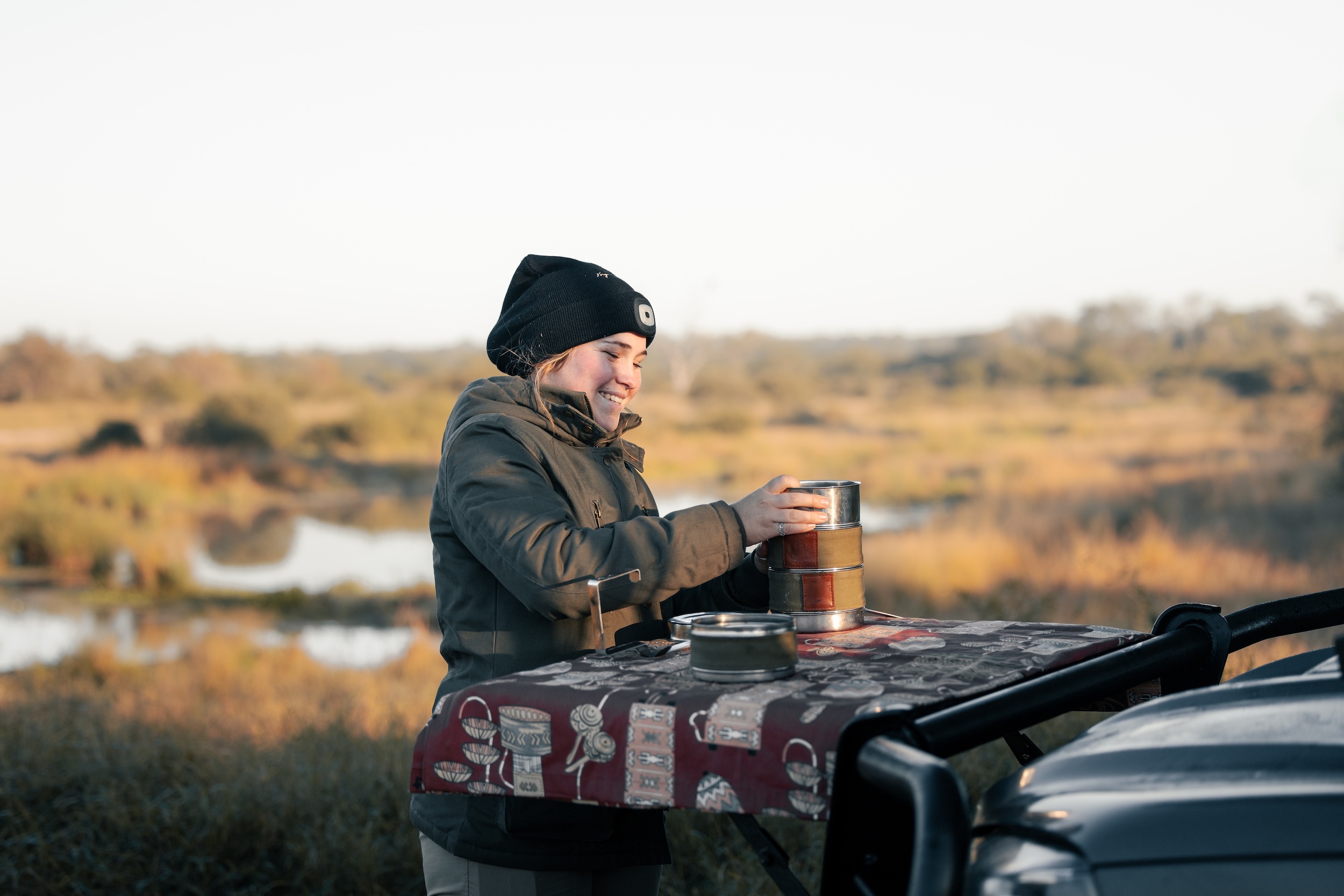 Traveller dressed in warm layers during an early morning winter safari in Kruger National Park